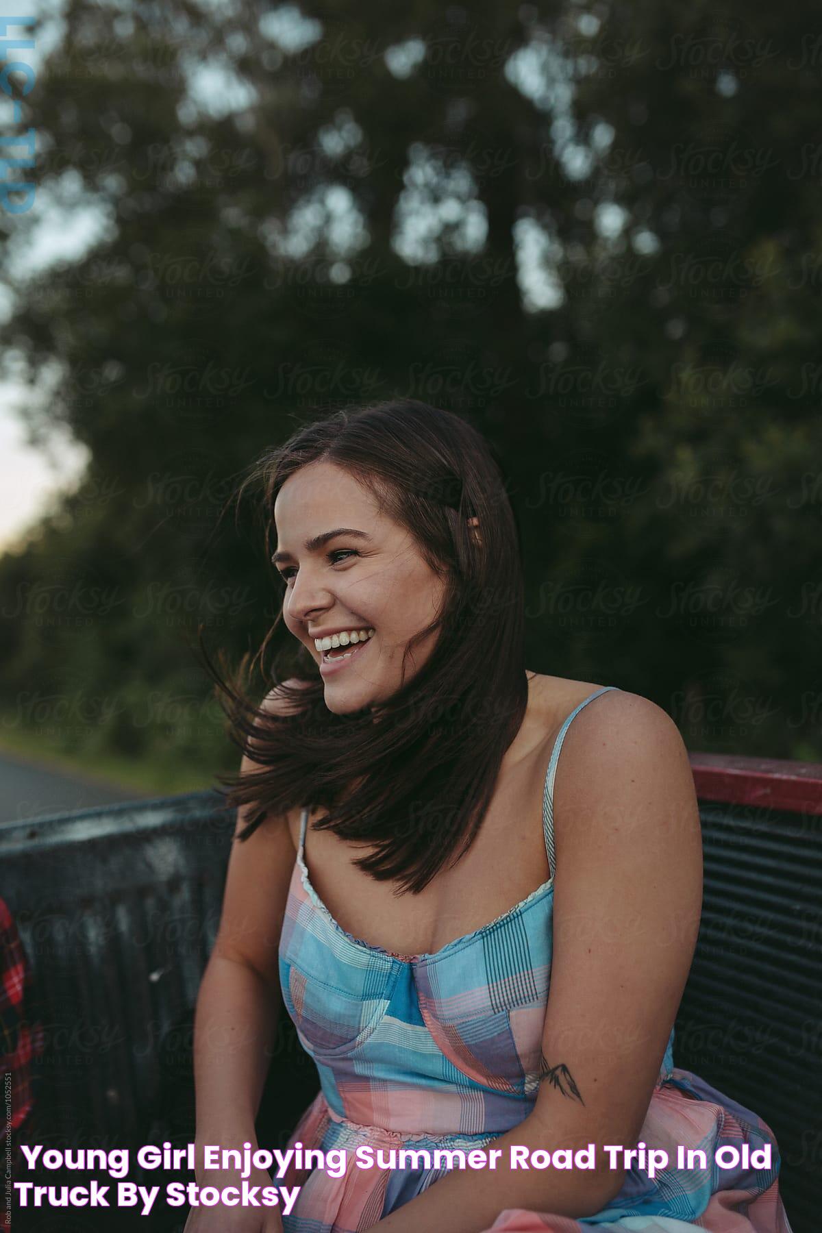 "Young Girl Enjoying Summer Road Trip In Old Truck" by Stocksy